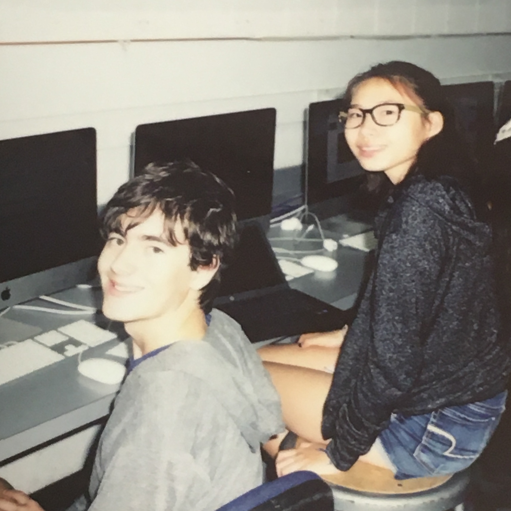 A polaroid of a friend and I doing work on computers in high school